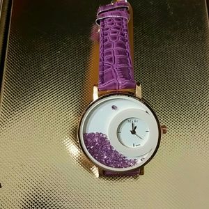 Watch. Brand new. Still has plastic connector